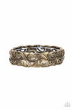 Antiqued brass paisley patterned frames are threaded along stretchy bands around the wrist, creating a rustic centerpiece.  Sold as one individual bracelet.