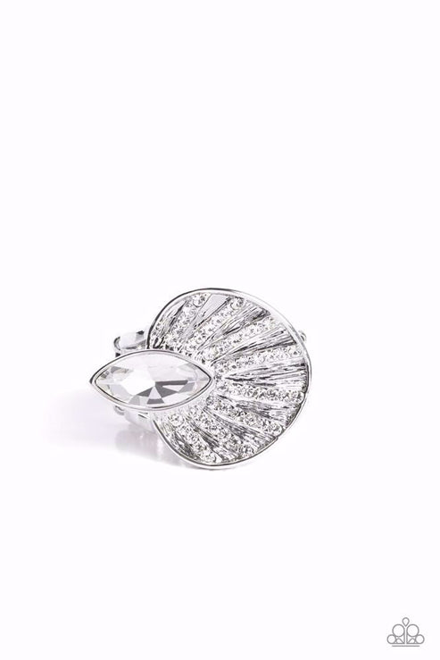 An asymmetrical silver disc, featuring linear layers of dainty white rhinestones against a textured backdrop, reflect light off its every angle from airy silver bands. A marquise-cut white gem interrupts the fan-like pendant, creating additional shine to the glitzy display. Features a stretchy band for a flexible fit.  Sold as one individual ring.  Life Of The Party August 2023