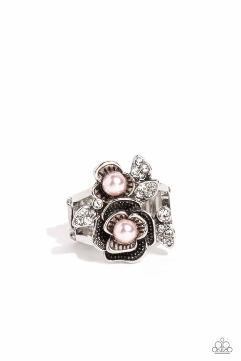 Rippling in ornate detail, folds of silver petals with pink pearl centers bloom atop the finger for a seasonal look. White rhinestone-encrusted silver leaves peek out from the airy floral display for additional sheen and glitz. Features a stretchy band for a flexible fit.  Sold as one individual ring.