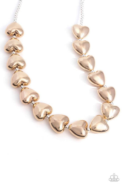 Infused along a classic silver chain, sleek gold hearts alternate with dainty silver beads along the neckline for a romantically refined statement. Features an adjustable clasp closure. Sold as one individual necklace. Includes one pair of matching earrings.