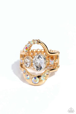 Featuring an embellishment of various-sized iridescent rhinestones and white gems, an airy, deconstructed gold oval glimmers atop the finger for a mesmerizing centerpiece. Each gold layer features various dimensions and pronged fittings, creating additional eye-catching detail. Features a stretchy band for a flexible fit. Due to its prismatic palette, color may vary.  Sold as one individual ring.