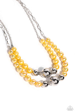 Infused along a silver paperclip and classic silver chain, a collection of glossy Lemon Drop pearls and high-sheen silver beads in various sizes cascade around the collar in layers for an elegant display. Features an adjustable clasp closure.  Sold as one individual necklace. Includes one pair of matching earrings.