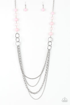 Polished pink, faceted crystal-like and delicately hammered silver hoops give way to mismatched silver chains down the chest for a whimsical look. Features an adjustable clasp closure.  Sold as one individual necklace. Includes one pair of matching earrings.