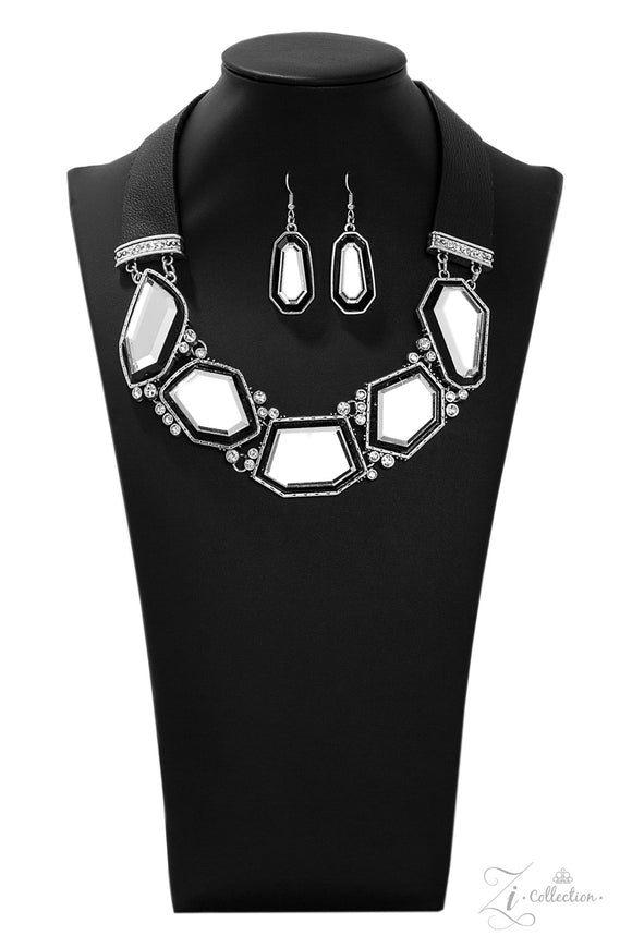 Two thick strips of black leather give way to a blinding collection of glassy geometric gems, creating a mirror-like fringe below the collar. Varying in shape, the blinding gems are pressed into hammered silver frames radiating with dainty white rhinestones for a commanding presence. Features an adjustable clasp closure.  Sold as one individual necklace. Includes one pair of matching earrings.