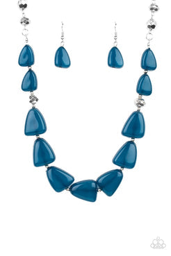 Infused with dainty silver and faceted silver beads, imperfect triangular opaque Mykonos Blue beads are threaded along an invisible wire below the collar for a refreshing pop of color. Features an adjustable clasp closure.  Sold as one individual necklace. Includes one pair of matching earrings. 