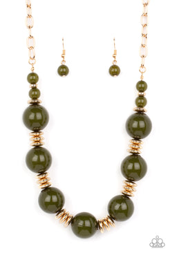 An oversized collection of glassy Olive Branch beads and shiny gold discs are threaded along an invisible wire, creating a dramatic pop of color below the collar. Features an adjustable clasp closure.  Sold as one individual necklace. Includes one pair of matching earrings.