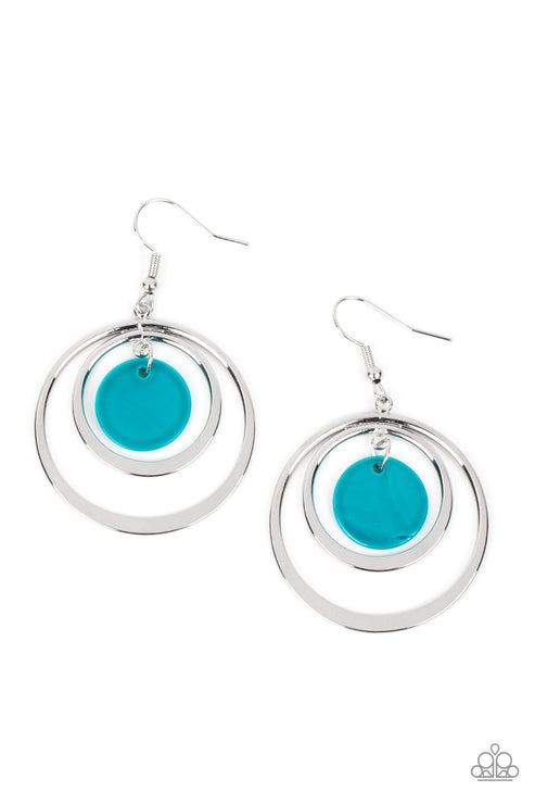 A blue shell-like disc swings from the top of a pair of shimmery silver rings, creating a tropical inspired hoop. Earring attaches to a standard fishhook fitting.  Sold as one pair of earrings.