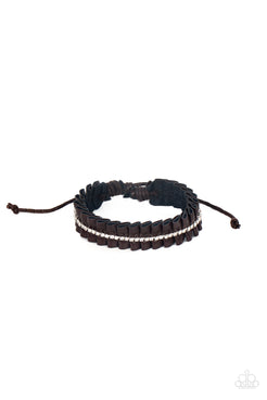 A brown leather ribbon delicately gathers into pleats around the wrist. A glittery strand of white rhinestones adorns the center of the pleats, adding a glitzy accent to the textured centerpiece. Features an adjustable sliding knot closure.  Sold as one individual bracelet.
