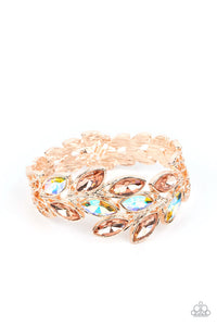 Rose gold and aurum iridescent marquise-cut gems blossom from an array of rose gold marquise frames embossed in leafy filigree and tactile studs. Each frame interlocks around the wrist in a whimsical pattern to create a laurel-inspired design. Features a hinged closure. Due to its prismatic palette, color may vary.  Sold as one individual bracelet.