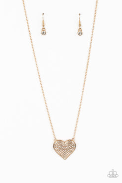 A heart-shaped pendant in a gold finish is anchored between two strands of delicate chain in the same reflective finish. The interior of the heart is filled with glittery white rhinestones, inviting onlookers to admire its unflinching sparkle. Features an adjustable clasp closure.  Sold as one individual necklace. Includes one pair of matching earrings.