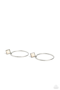 A twisted and textured silver oversized hoop, swings from the bottom of a silver-studded square frame, tilted on its point, with a refreshing white stone pressed in its center. The two rustic pieces cascade down the ear for a free-spirited finish, with eye-catching movement. Earring attaches to a standard post fitting. As the stone elements in this piece are natural, some color variation is normal.  Sold as one pair of post earrings.