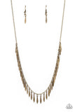 Dainty brass bars with a subtle curvature along their center, dance vivaciously along a brass chain to create a fierce fringe along the neckline. Each brass bar is flared at the bottom, expanding its light-catching surface to exaggerate the gleam that radiates from this monochromatic mashup. Features an adjustable clasp closure.  Sold as one individual necklace. Includes one pair of matching earrings.