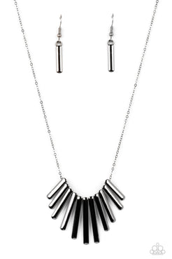 A collection of high-sheen gunmetal frames glide along a dainty gunmetal chain below the collar, stacking into a bowing fringe for a monochromatic masterpiece. Features an adjustable clasp closure.  Sold as one individual necklace. Includes one pair of matching earrings.