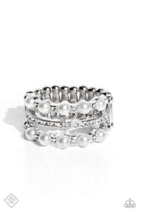 Dainty, bubbly white pearls and glittery white rhinestones are sprinkled across three airy silver bands, creating a refined centerpiece. The centermost band features rhinestones only, drawing the eye to its subtle sparkle. Features a stretchy band for a flexible fit.  Sold as one individual ring.