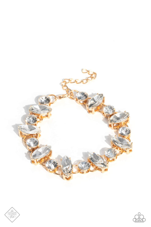 A blinding display of white marquise- and round-cut gems link around the wrist, creating a vintage-inspired design. Each gem is set in a pronged gold fitting, allowing light to scatter in every direction, leaving a lasting impression. Features an adjustable clasp closure.  Sold as one individual bracelet.