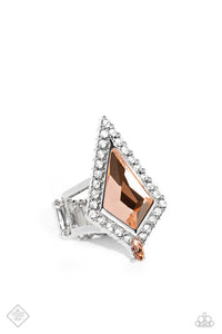 Pressed in a border of white gems and dainty silver studs, a dramatic kite-shaped peach gem stands out atop the finger. A dainty marquise-cut peach gem is pressed into the dramatic fringe, adding an additional pop of color along the fierce centerpiece. Features a stretchy band for a flexible fit.  Sold as one individual ring.