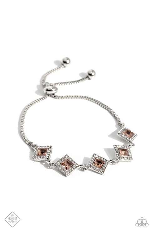 A collection of glassy, peach, square-cut gems are tilted on point and linked around the wrist, creating a glamorous display. Each gem is bordered by sparkling white rhinestones, adding irresistible glitz to the design. Finally, a silver box chain is threaded through a sleek silver bead, bringing a surprising hint of industrial grit to the mix. Features an adjustable sliding knot closure.  Sold as one individual bracelet.