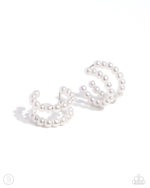 Infused along an invisible wire, a double-layered display of glossy white pearls curls around the ear creating an adjustable, one-size-fits-all refined cuff.  Sold as one pair of cuff earrings.