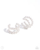 Infused along an invisible wire, a double-layered display of glossy white pearls curls around the ear creating an adjustable, one-size-fits-all refined cuff.  Sold as one pair of cuff earrings.