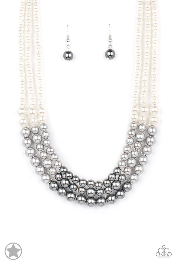 Strands of white, silver, and dark gray pearls elegantly drape below the collar, creating a beautiful ombre effect. Sectioned by silver accents, the luminescent pearls radiantly fall into a glamorous cascade. Features an adjustable clasp closure.  Sold as one individual necklace. Includes one pair of matching earrings.
