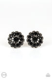 Dotted silver filigree spins around a black rhinestone encrusted center, swirling into a refined floral frame. Earring attaches to a standard clip-on fitting.  Sold as one pair of clip-on earrings.