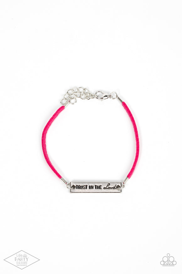 A strip of pink suede wraps around the wrist, joining a silver plate engraved with the phrase “Trust In The Lord” for an inspirational finish. Features an adjustable clasp closure. Sold as one individual bracelet.