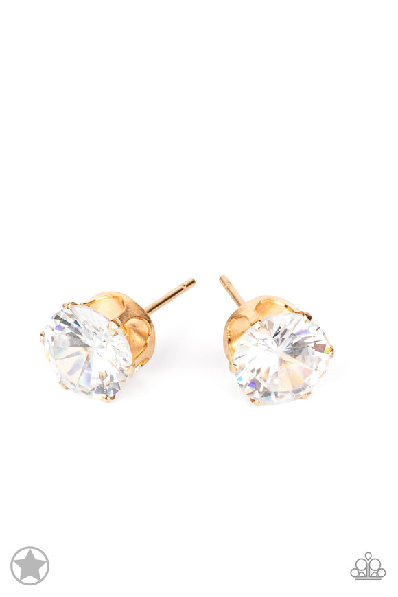 A sparkling white rhinestone is nestled inside a classic gold frame for a timeless look. Earring attaches to a standard post fitting.  Sold as one pair of post earrings.