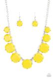 Bordered in silver studded square frames, a collection of yellow beaded frames delicately link below the collar for a colorfully rustic flair. Features an adjustable clasp closure.  Sold as one individual necklace. Includes one pair of matching earrings.