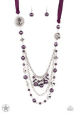 A silky purple ribbon replaces a traditional chain to create a timeless look. Pearly deep purple beads and funky silver pieces intermix with varying lengths of silver chains to give a fresh take on a Victorian-inspired piece.   Sold as one individual necklace. Includes one pair of matching earrings.