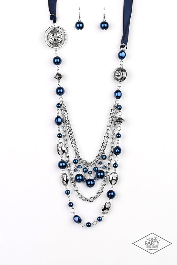 A silky blue ribbon replaces a traditional chain to create a timeless look. Pearly deep blue beads and funky silver pieces intermix with varying lengths of silver chains to give a fresh take on a Victorian-inspired piece.  Sold as one individual necklace. Includes one pair of matching earrings.