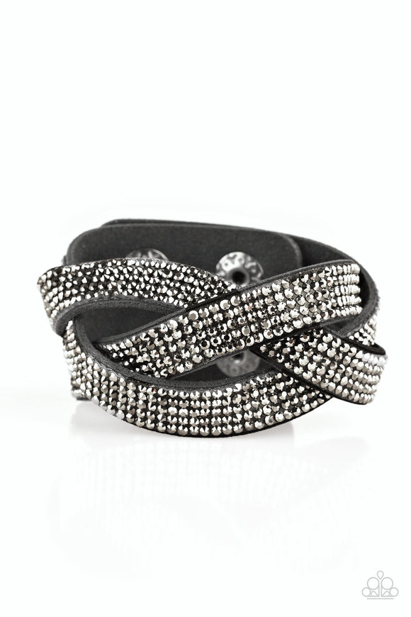Encrusted in row after row of glittery hematite rhinestones, three black suede bands braid across the wrist for a sassy look. Features an adjustable snap closure.  Sold as one individual bracelet.