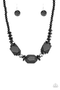 Featuring abstract geometric finishes, mismatched black wooden beads are threaded along shiny black cording. Dramatic silver beads are sprinkled between the earthy beading, creating a bold seasonal look below the collar. Features a button loop closure.  Sold as one individual necklace. Includes one pair of matching earrings.