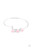 Glassy pink beads and glittery white rhinestones slide along a dainty silver wire infused with a rhinestone encrusted fitting, creating a versatile adjustable like bangle. Features a hinged closure.  Sold as one individual bracelet.