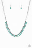 Turquoise teardrop stones and classic silver beads are threaded along an invisible wire. The earthy beads alternate below the collar, creating a wild fringe. Features an adjustable clasp closure.  Sold as one individual necklace. Includes one pair of matching earrings.