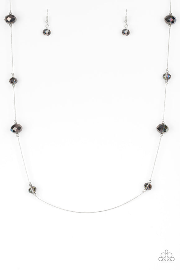 Infused with dainty silver accents, iridescent crystal-like beads trickle along a dainty silver chain across the chest for a refined look. Features an adjustable clasp closure.  Sold as one individual necklace. Includes one pair of matching earrings.