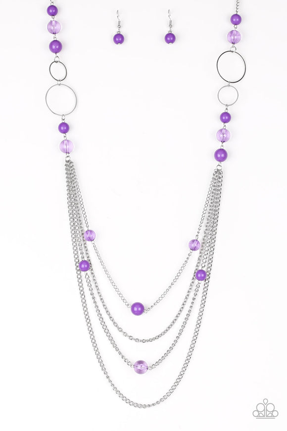 Infused with shimmery silver hoops, glassy and polished purple beads trickle along glistening silver chains for a bubbly look. Features an adjustable clasp closure.  Sold as one individual necklace. Includes one pair of matching earrings.