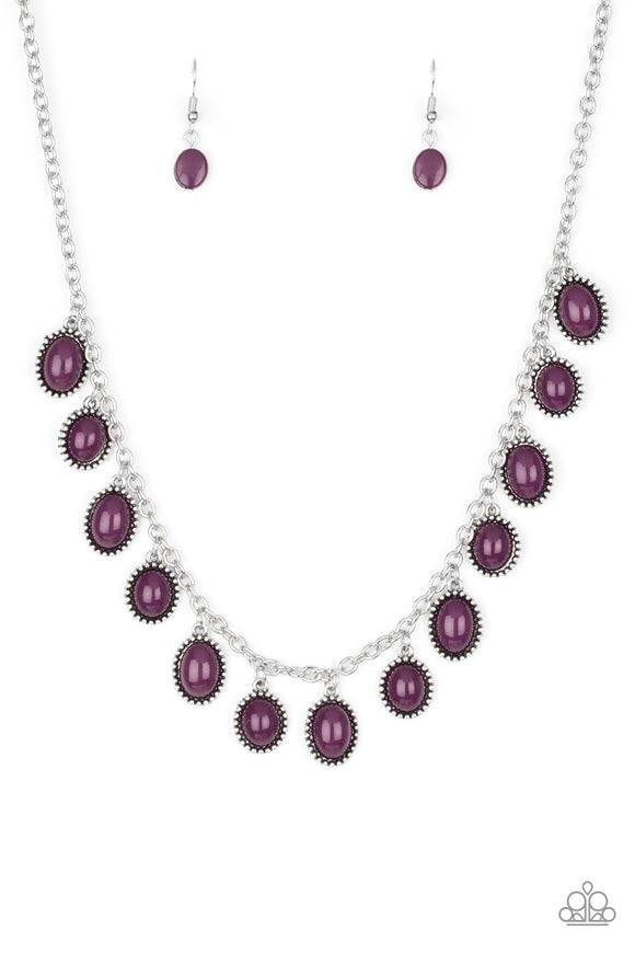 Infused with studded silver frames, round and oval purple beads swing from a shimmery silver chain, creating a vivacious fringe below the collar. Features an adjustable clasp closure.  Sold as one individual necklace. Includes one pair of matching earrings.