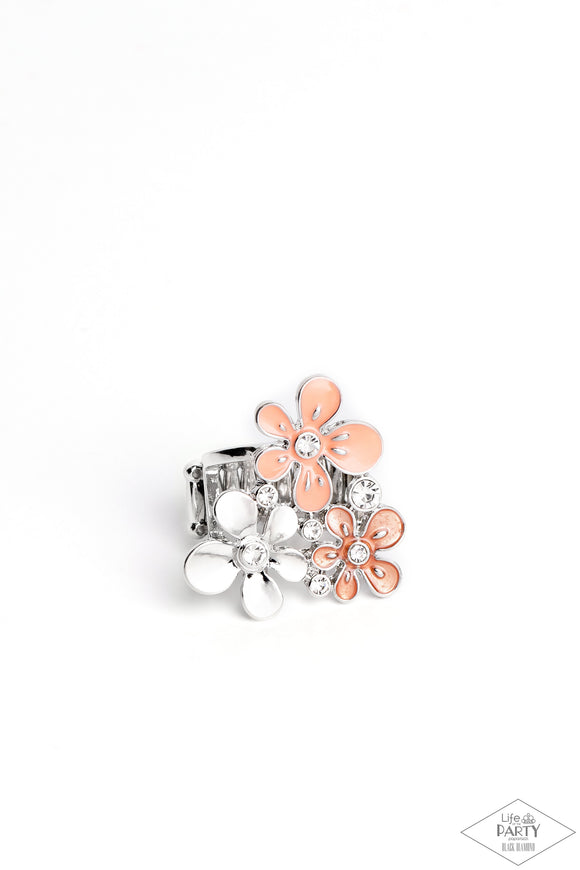 Two flowers in complementary shades of coral are paired with a silver flower in a sleek finish. Each flower is dotted with brilliant white rhinestones for flawless light-catching detail. Features a stretchy band for a flexible fit.  Sold as one individual ring.