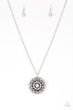 Neutral gray beads are sprinkled along ornate silver petals, creating a colorful floral frame. The whimsical pendant swings from the bottom of a lengthened silver chain for a seasonal look. Features an adjustable clasp closure. Sold as one individual necklace. Includes one pair of matching earrings.