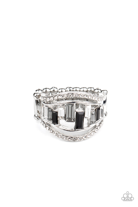 White rhinestone encrusted bands flank a row of emerald cut glass beads in shades of black, gray, and white for a regal look. Features a stretchy band for a flexible fit.  Sold as one individual ring.