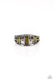 Three green emerald-cut rhinestones are encrusted along three gunmetal bands radiating with smooth surfaces and sections of glittery hematite rhinestones for an edgy fashion. Features a stretchy band for a flexible fit.  Sold as one individual ring.