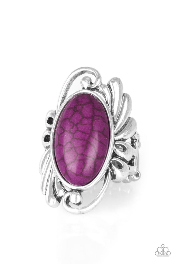 Chiseled into a smooth oval, a rich purple stone is pressed into the center of a glistening silver frame radiating with filigree detail for a seasonal look. Features a stretchy band for a flexible fit.  Sold as one individual ring.