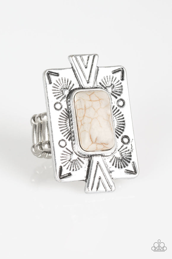 Chiseled into a tranquil rectangle, a refreshing white stone is pressed into a bold silver frame radiating with tribal inspired patterns for a seasonal look. Features a stretchy band for a flexible fit.  Sold as one individual ring