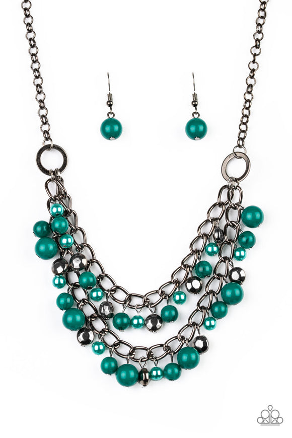 Pearly and polished green beading joins faceted gunmetal beads along a bold gunmetal chain, creating a sassy fringe below the collar.