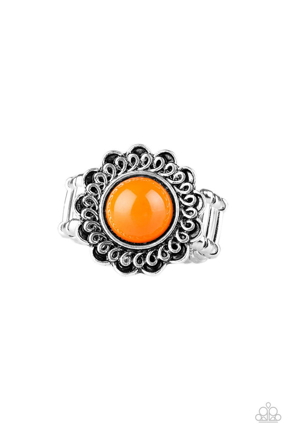 A vivacious orange bead is pressed into the center of a shimmery floral frame radiating with swirling detail. Features a stretchy band for a flexible fit.  Sold as one individual ring.