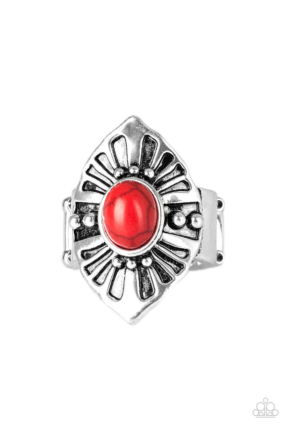 A fiery red stone bead is pressed into the center of an angular silver frame radiating with studded and antiqued textures. Features a stretchy band for a flexible fit.  Sold as one individual ring.
