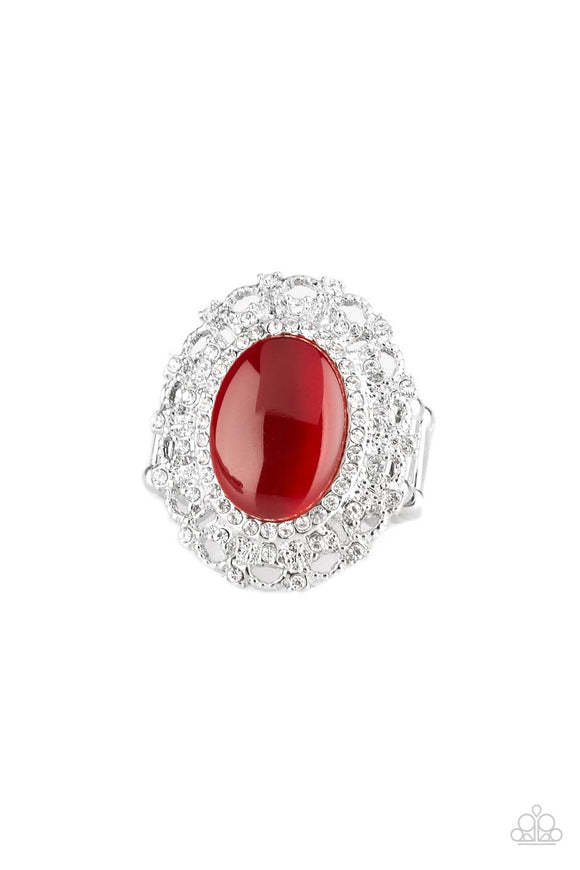 Encrusted in dainty white rhinestones, a frilly silver frame spins around a glowing red moonstone center for a regal look. Features a stretchy band for a flexible fit.  Sold as one individual ring.