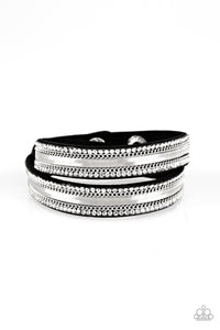 Rows of classic silver chain, flat silver chain, and dainty white rhinestones are encrusted along a black suede band for a sassy look. The elongated band allows for a trendy double wrap design. Features an adjustable snap closure.  Sold as one individual bracelet.