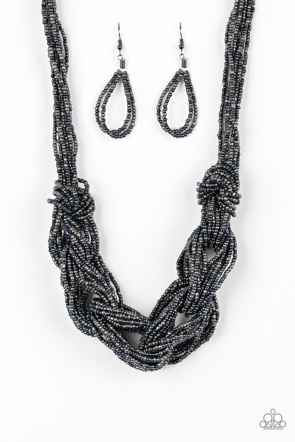 Brushed in a flashy metallic finish, countless strands of blue and gunmetal seed beads weave into a bulky square braid below the collar for a glamorous look. Features an adjustable clasp closure.  Sold as one individual necklace. Includes one pair of matching earrings.