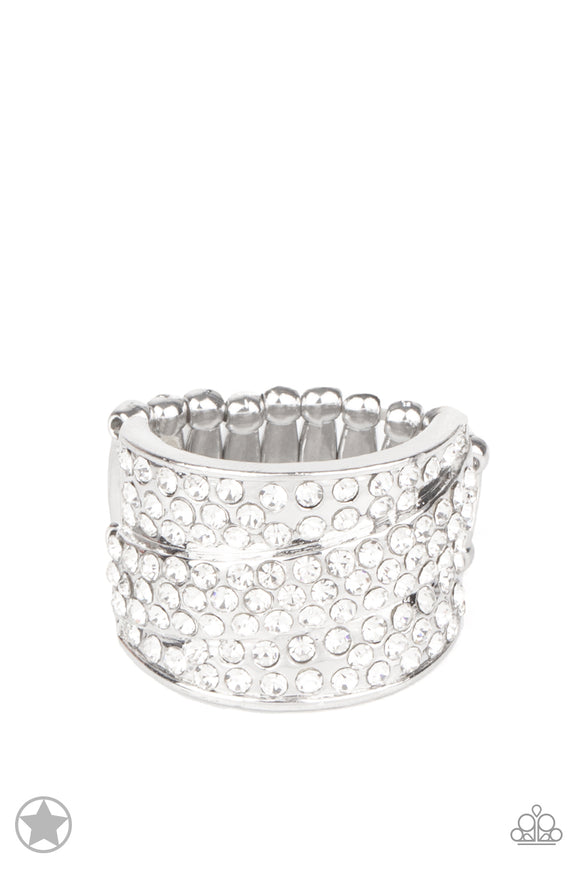 Row upon row of glistening white rhinestones stack into an incandescent display. An additional row of sparkling rhinestones wraps diagonally across the band for an extra splash of refined shimmer. Features a stretchy band for a flexible fit.  Sold as one individual ring.